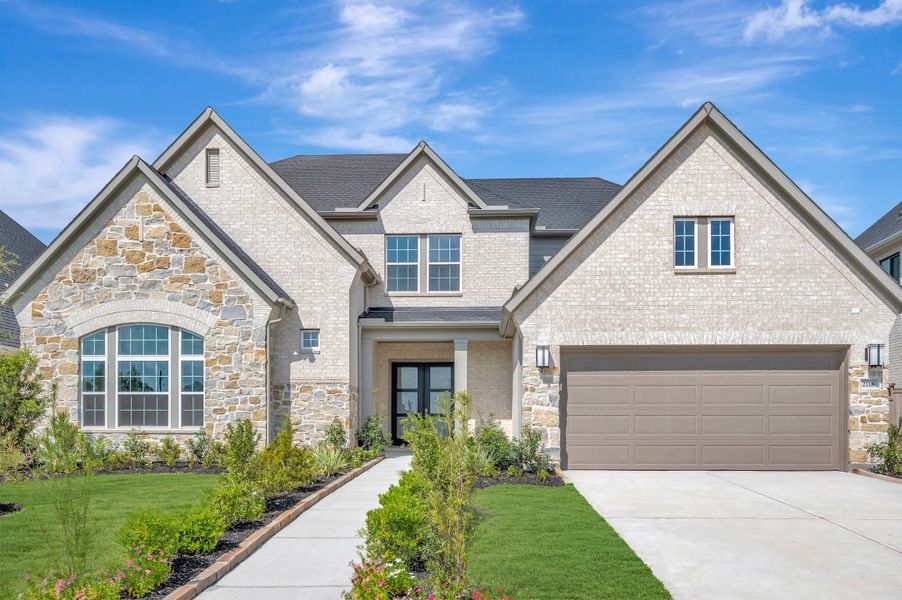 Front exterior of a new home in Sienna - Parkview Collection, Missouri City, TX, highlighting curb appeal (Image 27). Front exterior of a new home in Sienna - Parkview Collection, Missouri City, TX, highlighting curb appeal (Image 27).