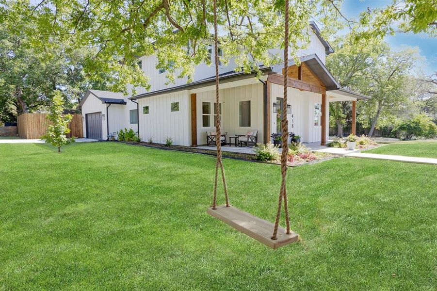 This peaceful yard and porch are made for slow mornings and long quiet evenings. This peaceful yard and porch are made for slow mornings and long quiet evenings.