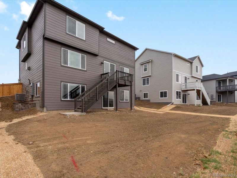 Front exterior of a new home in Buffalo Highlands: The Canyon Collection, Commerce City, CO, highlighting curb appeal (Image 2). Front exterior of a new home in Buffalo Highlands: The Canyon Collection, Commerce City, CO, highlighting curb appeal (Image 2).