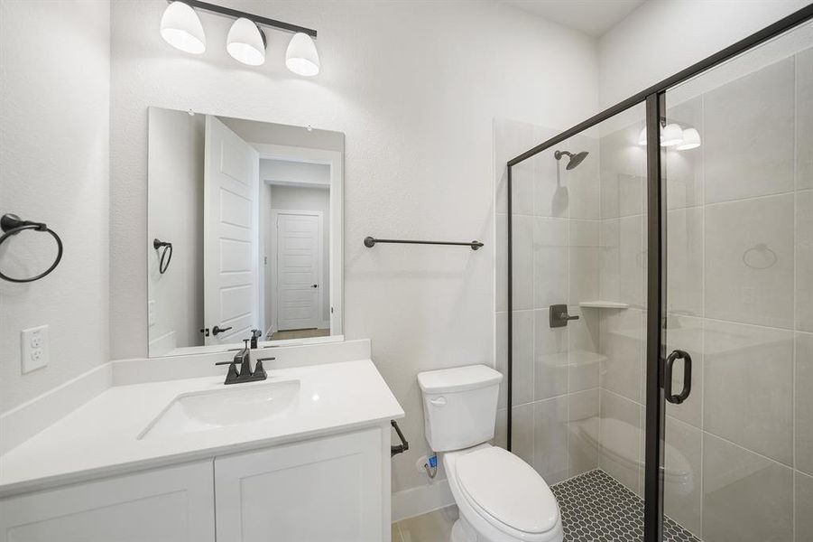 Full bathroom featuring vanity and a shower stall Full bathroom featuring vanity and a shower stall