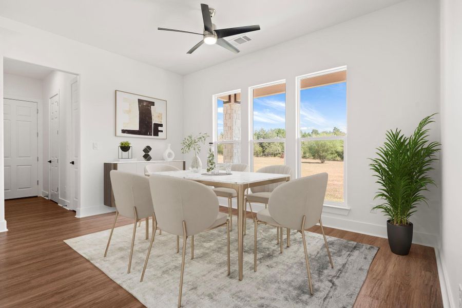 Dining space with wood finished floors and ceiling fan Dining space with wood finished floors and ceiling fan