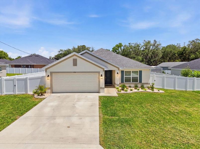 Front exterior of a new home in Orange Blossom Hills, Summerfield, FL, highlighting curb appeal (Image 26). Front exterior of a new home in Orange Blossom Hills, Summerfield, FL, highlighting curb appeal (Image 26).