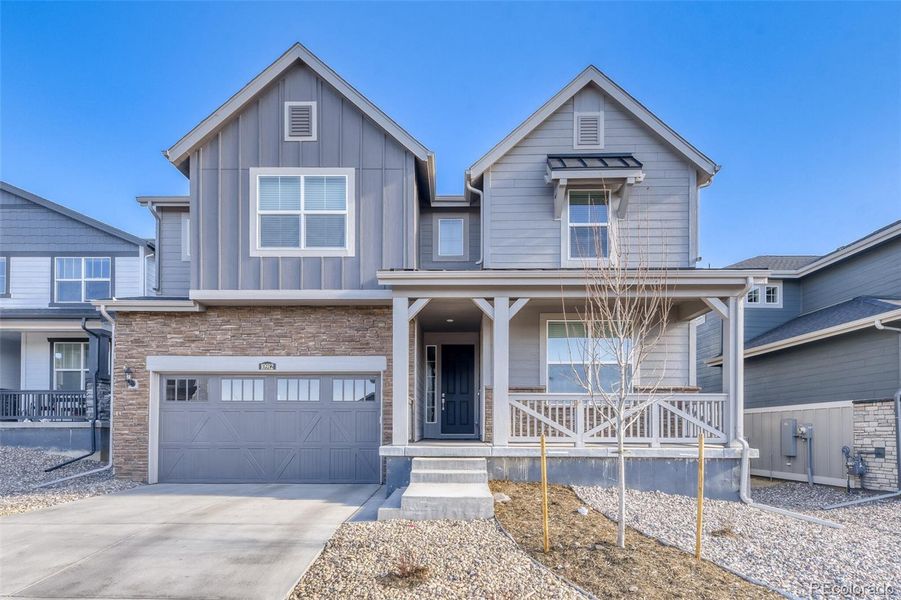 Front exterior of a new home in Newlin Crossing, Parker, CO, highlighting curb appeal (Image 24).