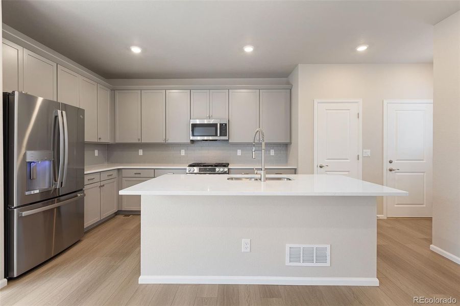 Furnished interior view inside a new home in Woodrose at Painted Prairie, Aurora (Image 4).
