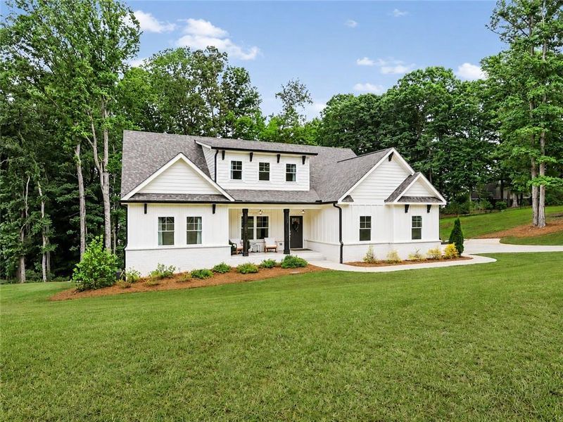 Front exterior of a new home in , Hoschton, GA, highlighting curb appeal (Image 2). Front exterior of a new home in , Hoschton, GA, highlighting curb appeal (Image 2).