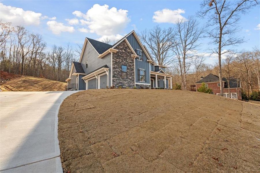 Front exterior of a new home in , Carrollton, GA, highlighting curb appeal (Image 28).