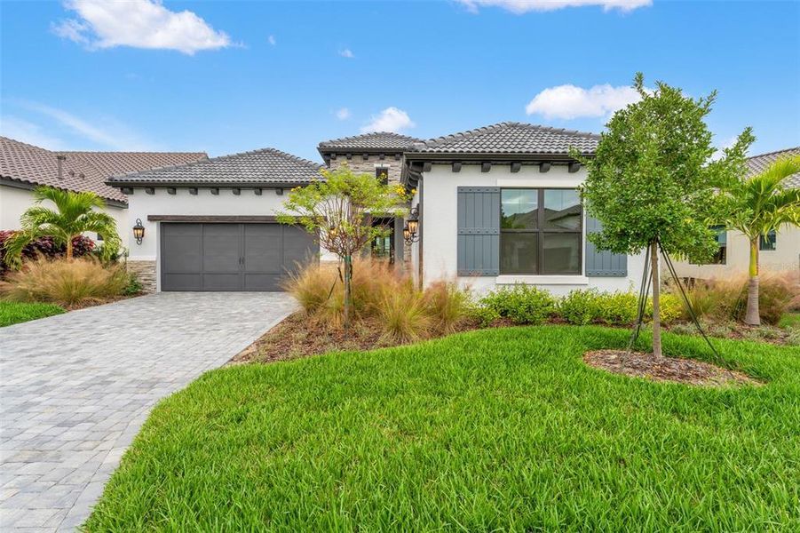 Front exterior of a new home in , Nokomis, FL, highlighting curb appeal (Image 25). Front exterior of a new home in , Nokomis, FL, highlighting curb appeal (Image 25).