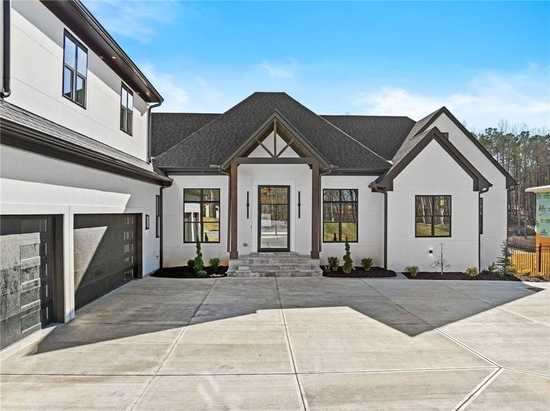 Front exterior of a new home in , Flowery Branch, GA, highlighting curb appeal (Image 2). Front exterior of a new home in , Flowery Branch, GA, highlighting curb appeal (Image 2).