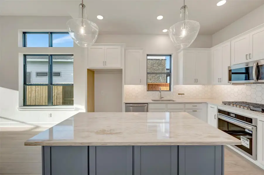 Furnished interior view inside a new home in Sienna - Landmark Row Collection, Missouri City (Image 6).