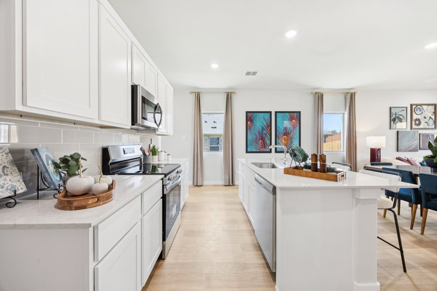 Kitchen in a Belmont Magnolia Model Home in Aubrey TX by Trophy Signature Homes
