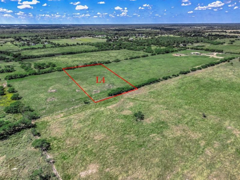 Aerial view highlighting Lot 4, showcasing a 5-acre homesite with open space, surrounding acreage, and a sense of privacy within the subdivision.