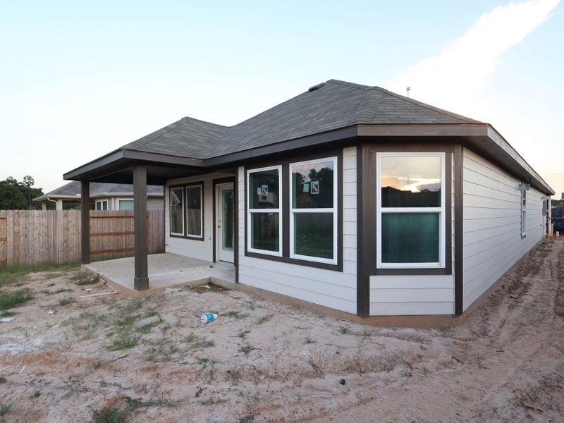 Front exterior of a new home in Magnolia Ridge, Magnolia, TX, highlighting curb appeal (Image 12). Front exterior of a new home in Magnolia Ridge, Magnolia, TX, highlighting curb appeal (Image 12).