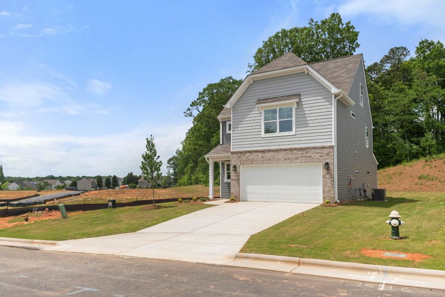 Front exterior of a new home in Chandler Ridge, McLeansville, NC, highlighting curb appeal (Image 2).