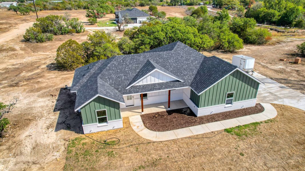Representative exterior photo of a completed home built from the Lucas by Zeal Home Builders in Echo Grove, Poolville, TX (Image 42).