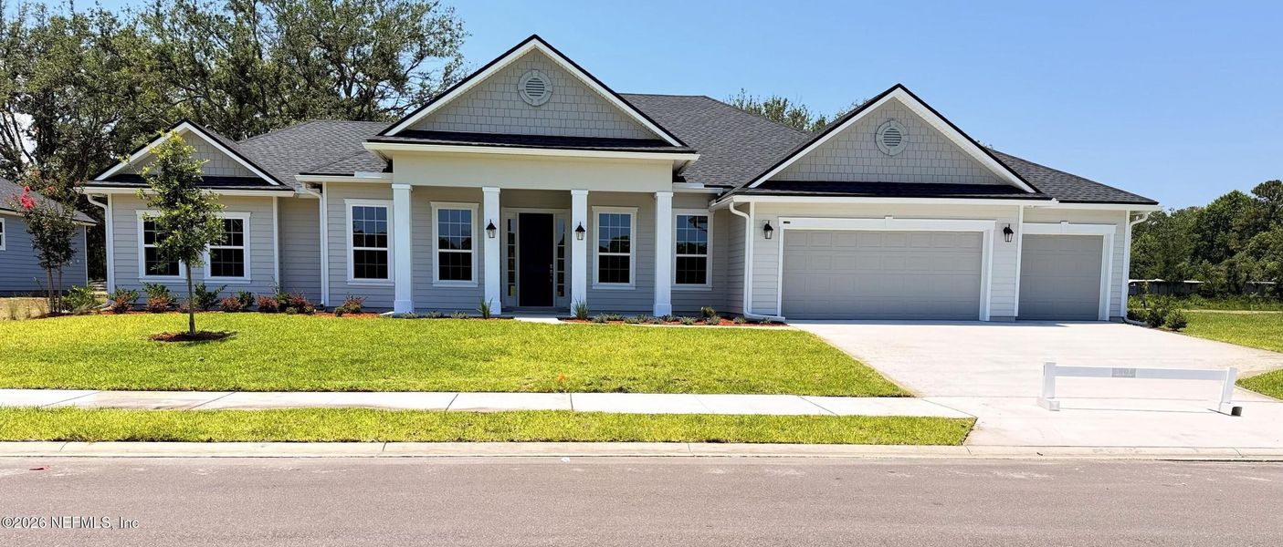 Front exterior of a new home in , Jacksonville, FL, highlighting curb appeal (Image 1). Front exterior of a new home in , Jacksonville, FL, highlighting curb appeal (Image 1).