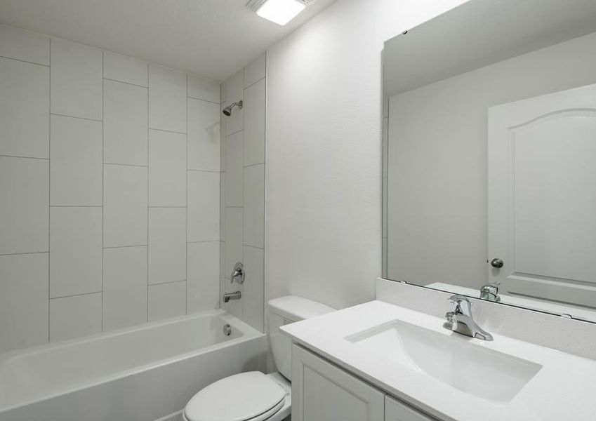 The guest bathroom has a spacious vanity, ready for your guests