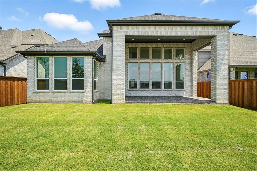 Front exterior of a new home in Mosaic: Classic Series - 50ft. Lots, Celina, TX, highlighting curb appeal (Image 1).