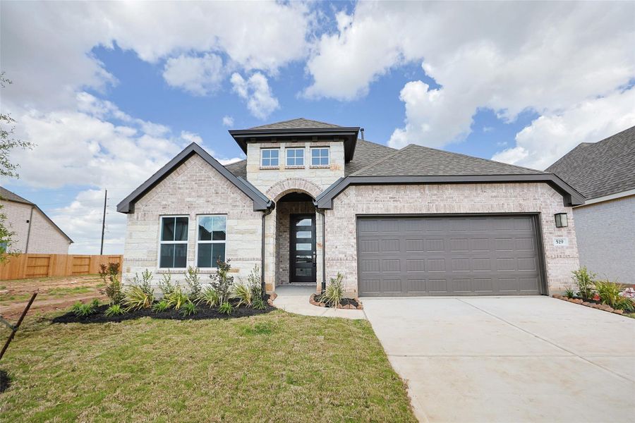 Front exterior of a new home in Brookewater, Rosenberg, TX, highlighting curb appeal (Image 22).