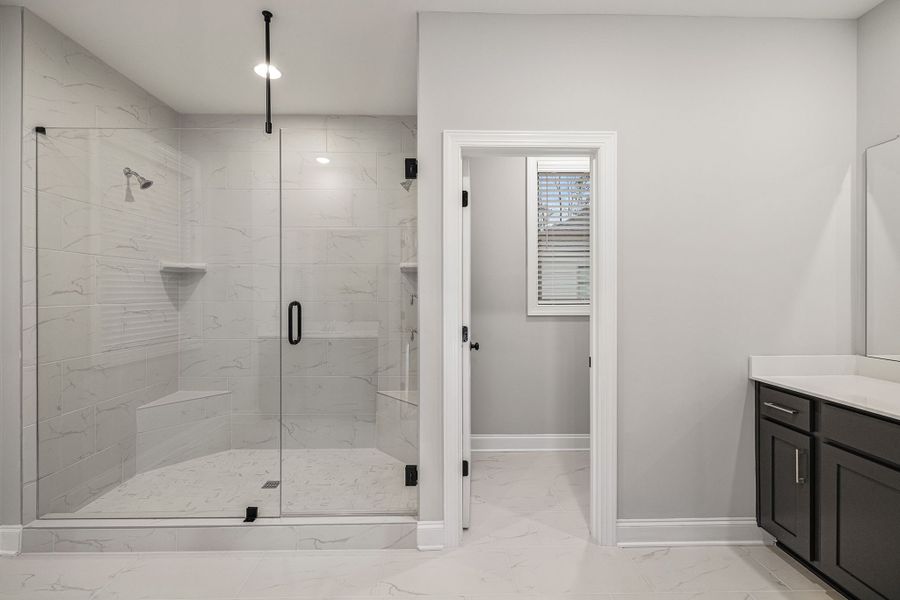 Large walk in shower featured in primary bathroom