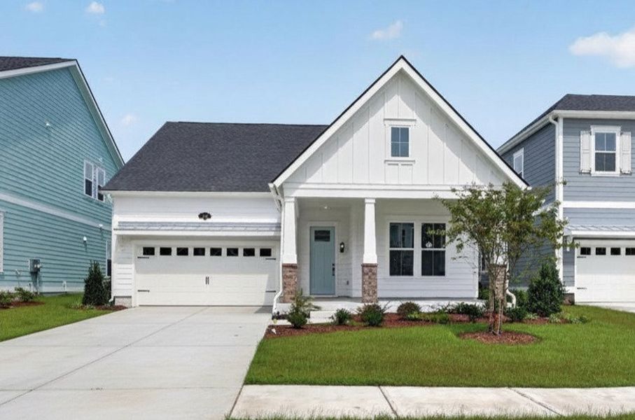 Front exterior of a new home in Beach View at Grande Dunes, Myrtle Beach, SC, highlighting curb appeal (Image 1). Front exterior of a new home in Beach View at Grande Dunes, Myrtle Beach, SC, highlighting curb appeal (Image 1).