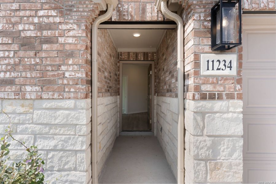 Exterior details and patio area of a home in Prairie Green, Converse (Image 22).