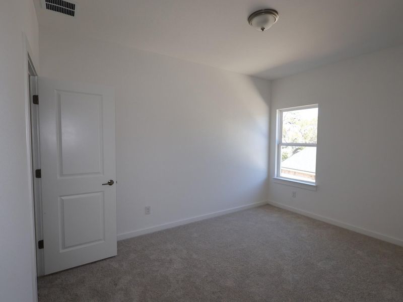 Spacious, unfurnished interior of a new home in Heritage, Dripping Springs (Image 9). Spacious, unfurnished interior of a new home in Heritage, Dripping Springs (Image 9).