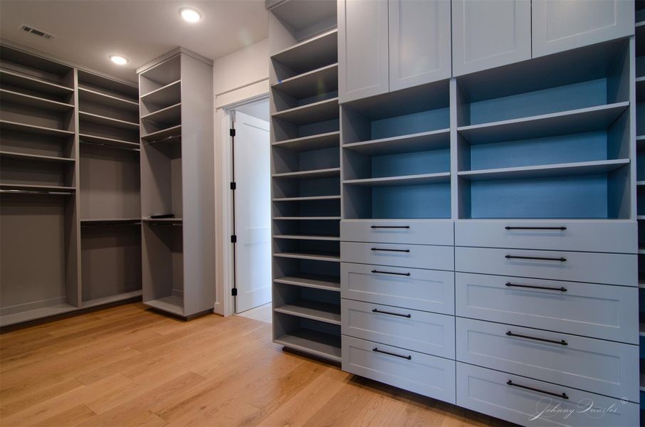 Primary Closet with over 24 built in shelves, and 2 dressers Primary Closet with over 24 built in shelves, and 2 dressers