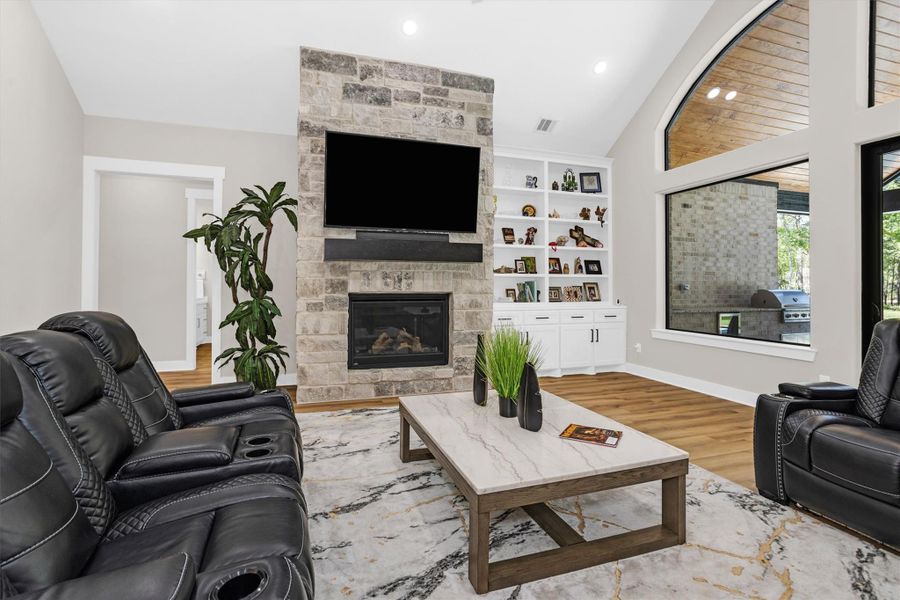 Stone fireplace and built-in shelving