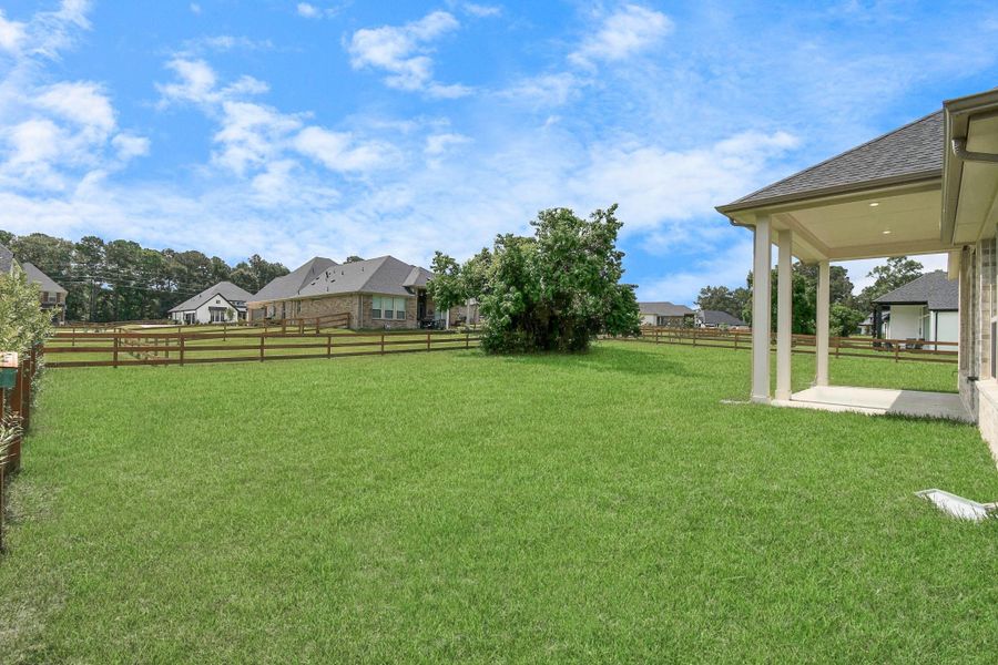 Front exterior of a new home in Timber Hollow: Heritage Collection, Magnolia, TX, highlighting curb appeal (Image 21). Front exterior of a new home in Timber Hollow: Heritage Collection, Magnolia, TX, highlighting curb appeal (Image 21).
