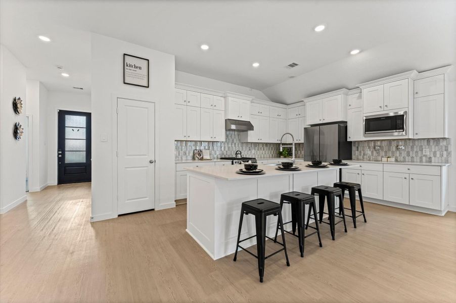 Open concept kitchen with ceiling to floor cabinets Open concept kitchen with ceiling to floor cabinets