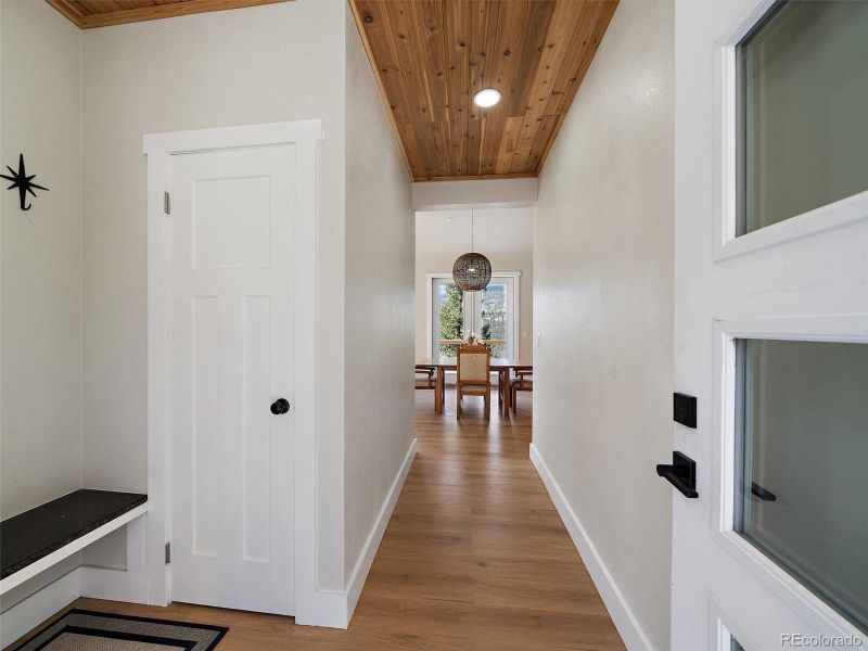 Entry way, perfect for hanging jackets and extra closet space for storage.