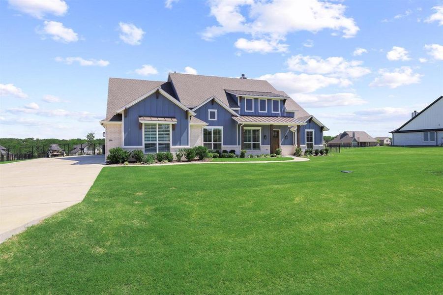 Front exterior of a new home in The Meadows, Gunter, TX, highlighting curb appeal (Image 2). Front exterior of a new home in The Meadows, Gunter, TX, highlighting curb appeal (Image 2).