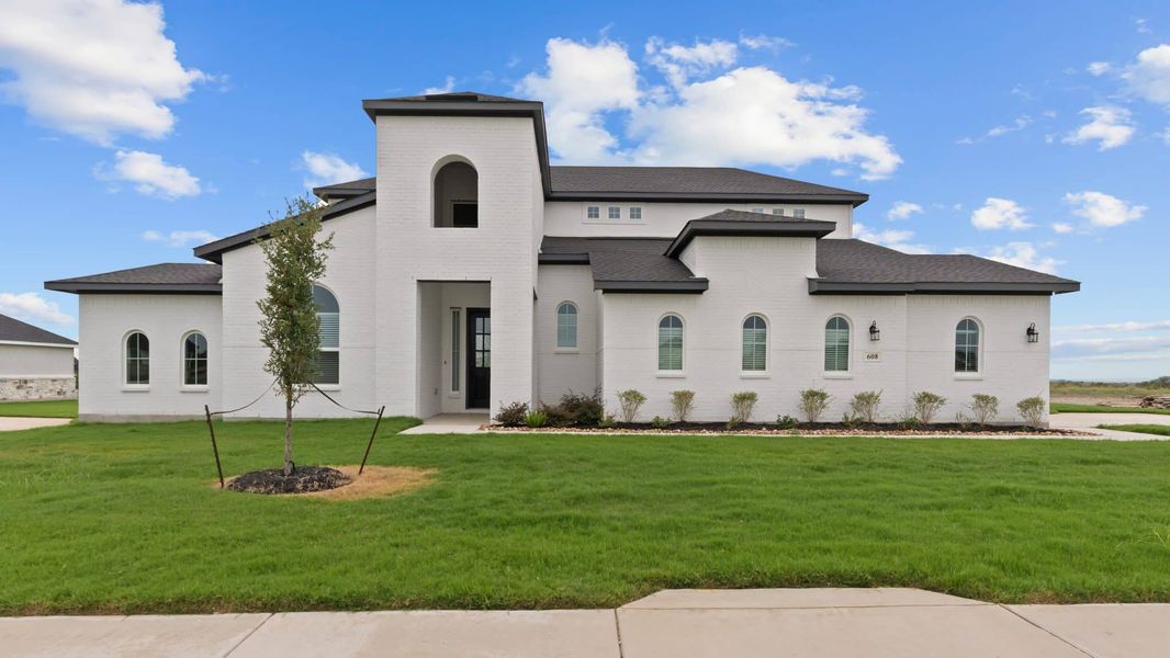 Representative exterior photo of a completed home built from the Cohen by Chesmar Homes in Sienna Lakes, San Antonio, TX (Image 15).