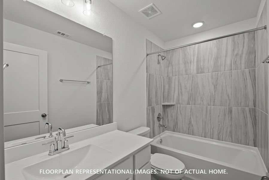 Furnished interior view inside a new home in The Oaks on 6th Street, Magnolia (Image 9).