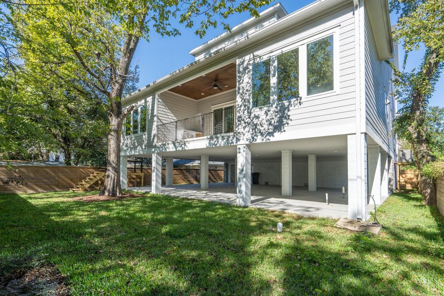 Thoughtfully designed backyard with architectural elevation, privacy fencing, and generous green space. Thoughtfully designed backyard with architectural elevation, privacy fencing, and generous green space.