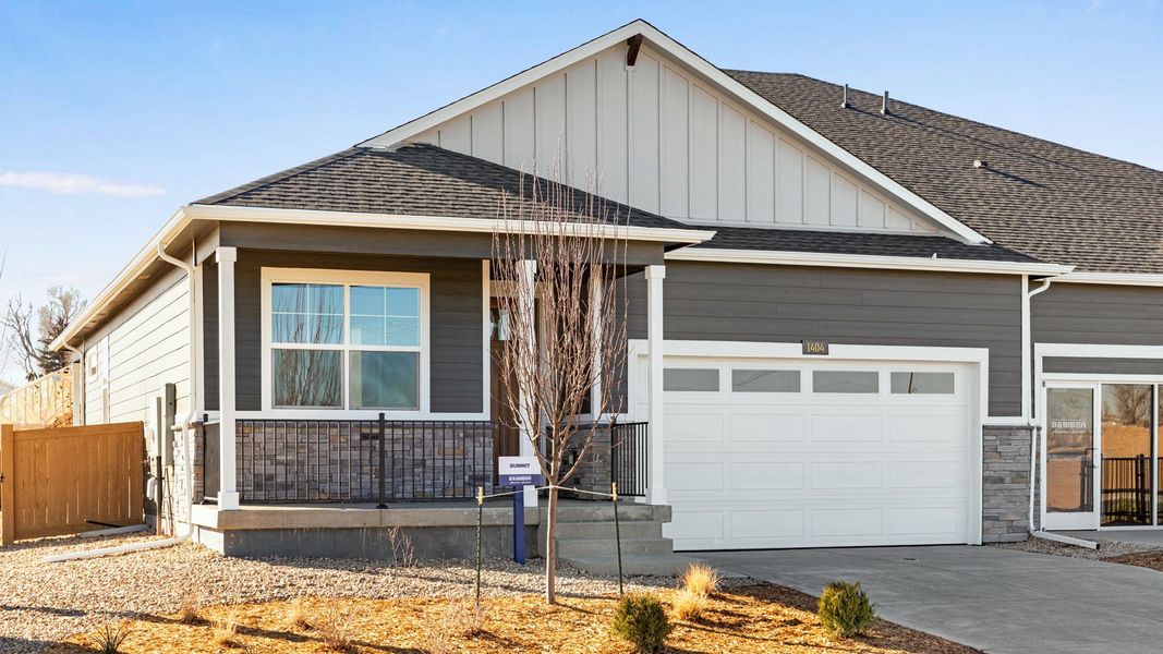 Front exterior of a new home in Trevenna, Windsor, CO, highlighting curb appeal (Image 1). Front exterior of a new home in Trevenna, Windsor, CO, highlighting curb appeal (Image 1).