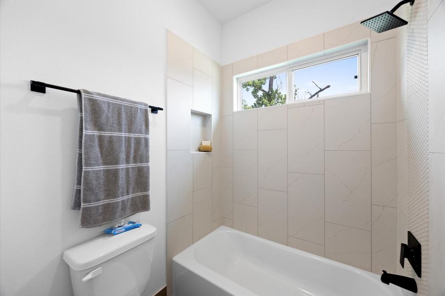 The bathtub and shower combination is a practical addition, offering versatility for soaking or quick showers. The bathtub and shower combination is a practical addition, offering versatility for soaking or quick showers.