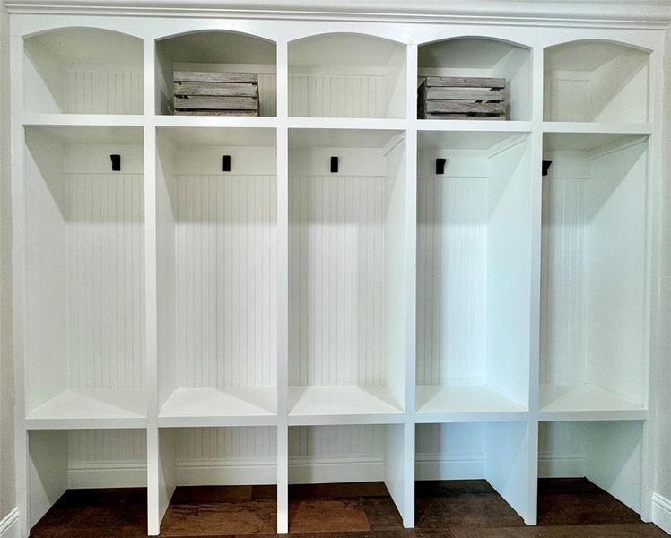 Mudroom with dark wood-style flooring