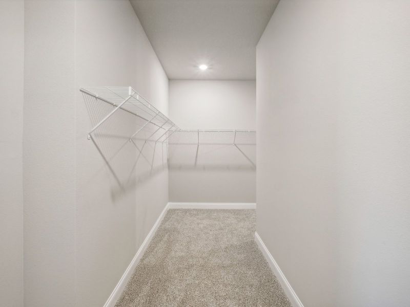 Primary Closet in the Onyx floorplan at 6406 NW Sweetwood Drive