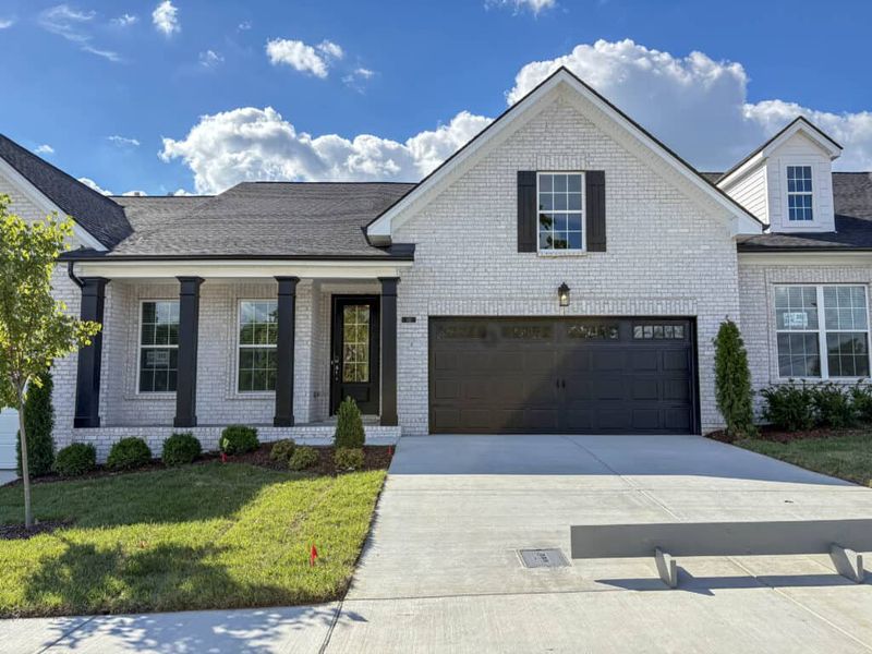 Front exterior of a new home in Stonecrest Townhomes, Hendersonville, TN, highlighting curb appeal (Image 1). Front exterior of a new home in Stonecrest Townhomes, Hendersonville, TN, highlighting curb appeal (Image 1).