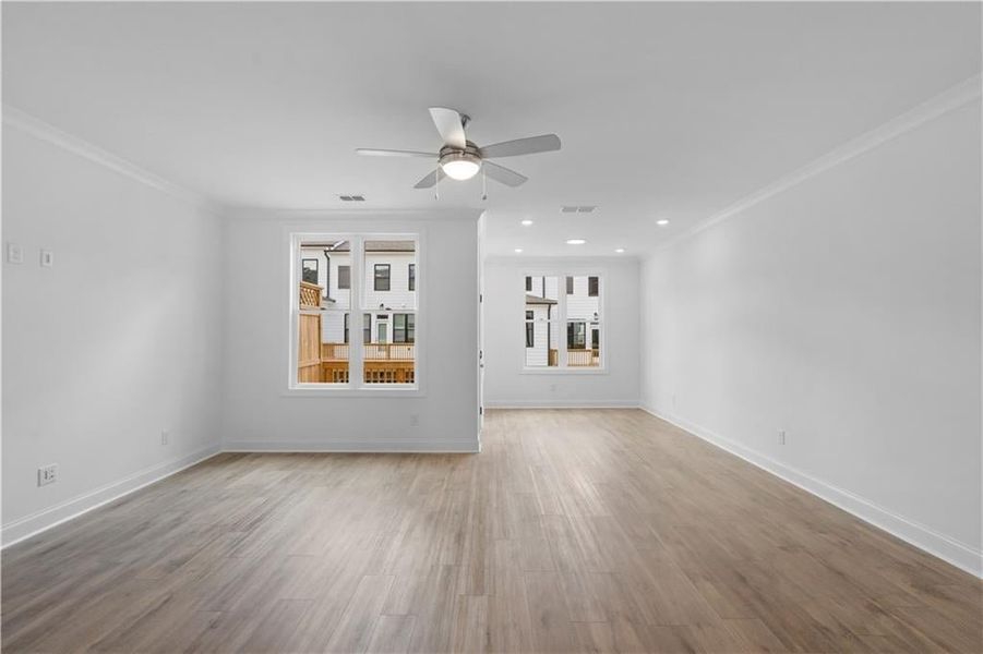 family room leading into sunroom - *Pictures represent a previously built home, not the actual home, home is under construction*
