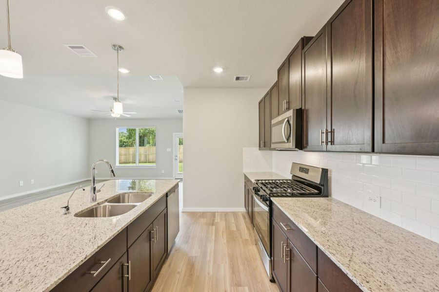 Furnished interior view inside a new home in Sundance Cove - Premier Series, Crosby (Image 7).