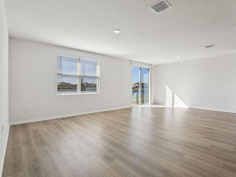Spacious, unfurnished interior of a new home in Villamar - Signature Series, Winter Haven (Image 8).