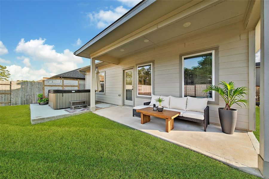 Exterior details and patio area of a home in Magnolia Place, Magnolia (Image 4).