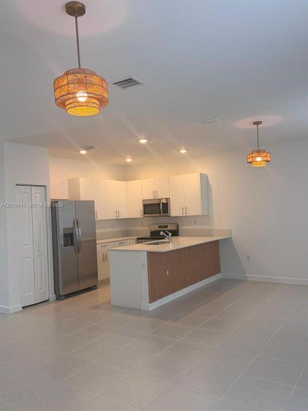 Furnished interior view inside a new home in , Homestead (Image 12). Furnished interior view inside a new home in , Homestead (Image 12).