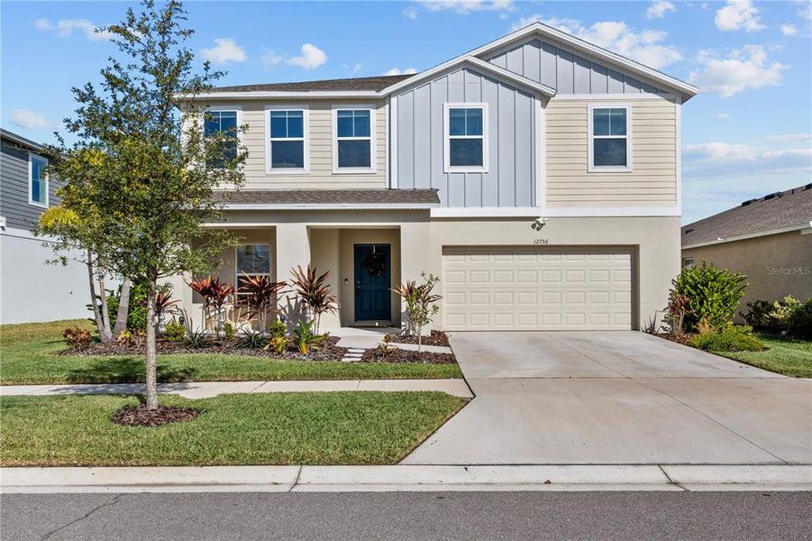 Front exterior of a new home in Hawkstone, Lithia, FL, highlighting curb appeal (Image 2). Front exterior of a new home in Hawkstone, Lithia, FL, highlighting curb appeal (Image 2).