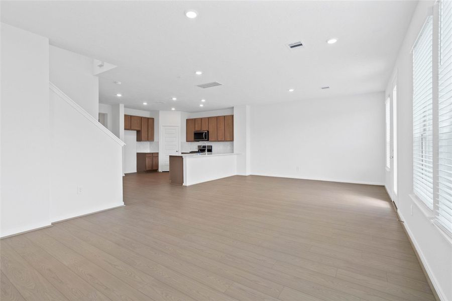 Open-concept design seamlessly connecting the living, dining, and kitchen areas—perfect for both everyday living and entertaining!