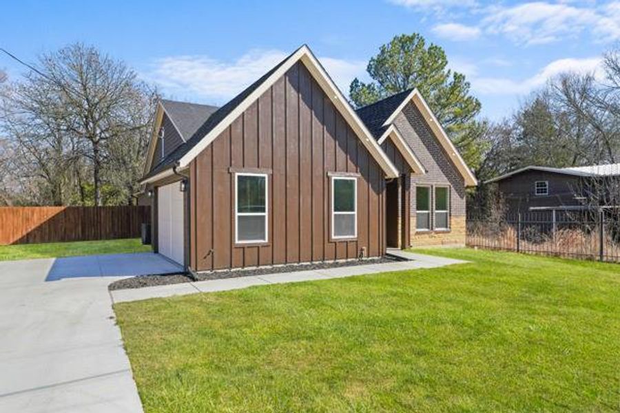 Front exterior of a new home in , Tool, TX, highlighting curb appeal (Image 2). Front exterior of a new home in , Tool, TX, highlighting curb appeal (Image 2).