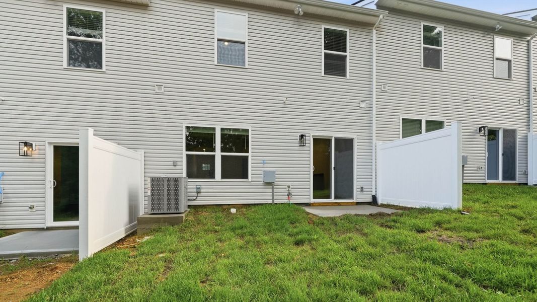 Exterior details and patio area of a home in Macon Townhomes, Seymour (Image 3).