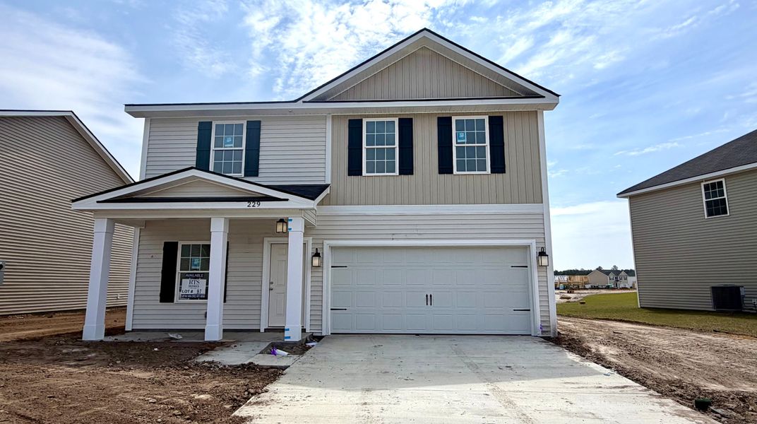 Front exterior of a new home in Grand Reserve, Hinesville, GA, highlighting curb appeal (Image 1). Front exterior of a new home in Grand Reserve, Hinesville, GA, highlighting curb appeal (Image 1).